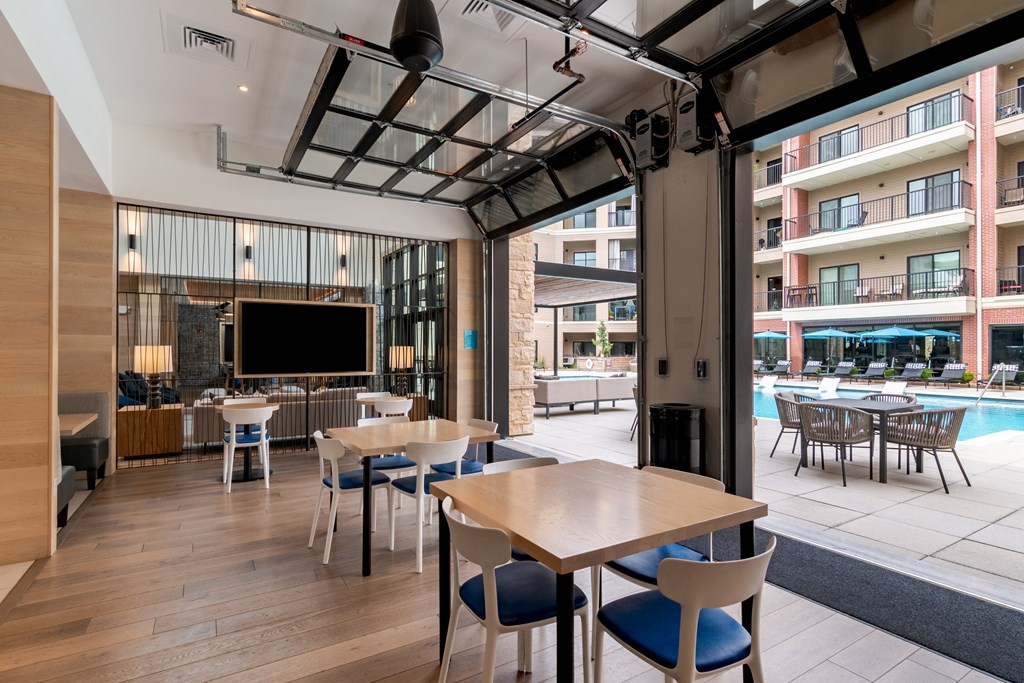 a room filled with furniture and a large window  at Century West Pryor, Lee's Summit, MO