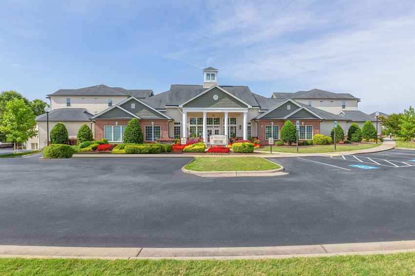 a large parking lot in front of a large house - Photo Gallery 1