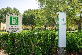 a charging station in front of a garden