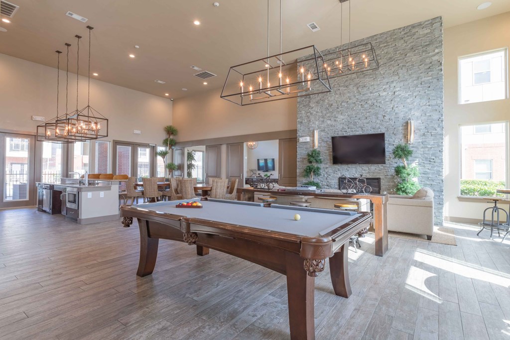 a clubhouse with a pool table and a tv at Century Palm Bluff, Portland, 78374