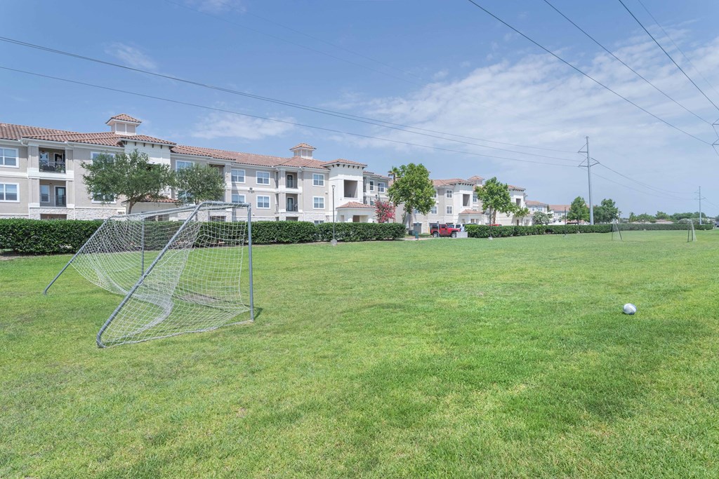 a soccer field at the whispering winds apartments in pearland, tx at Century South Shore, League City