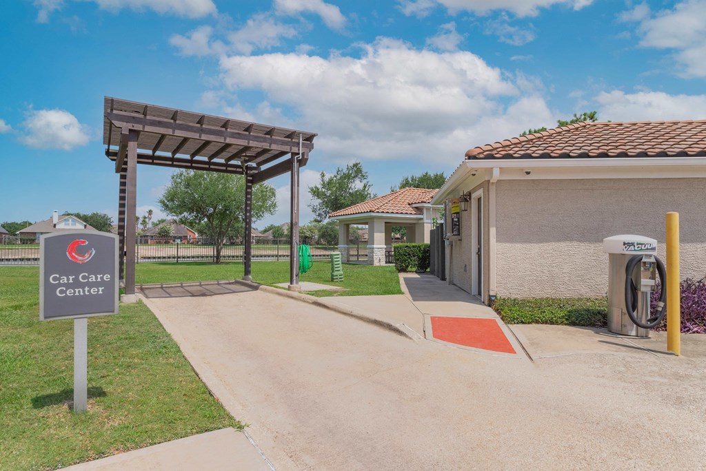 the entrance to the car care center at the whispering winds apartments in pearland, tx at Century South Shore Apartments, League City, 77573