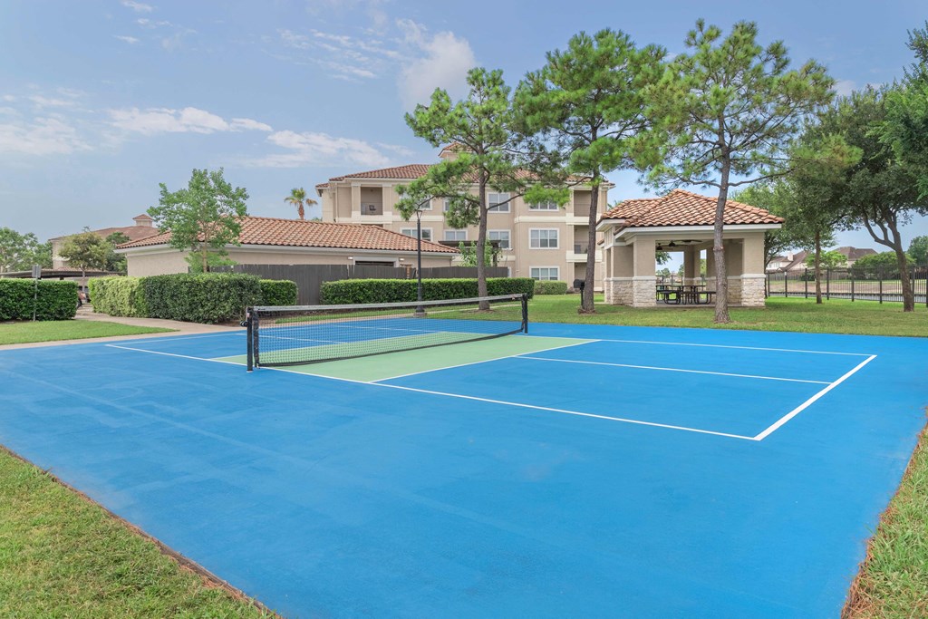 tennis court at the whispering winds apartments in pearland, tx at Century South Shore Apartments, League City, 77573