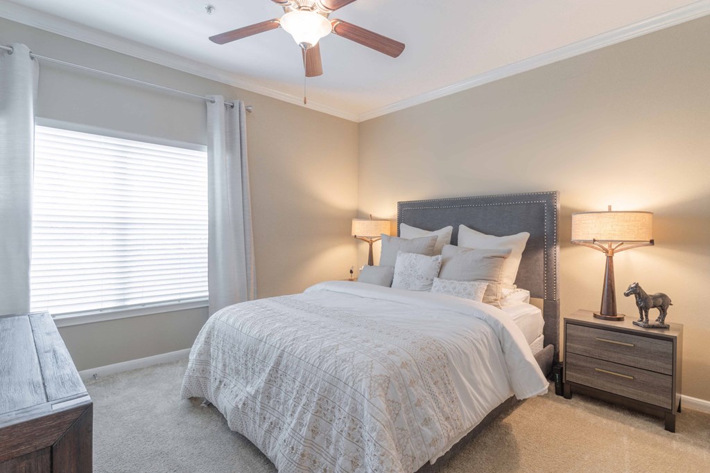 a bedroom with a bed and a ceiling fan a bedroom with a bed and a ceiling fan at Century South Shore, Texas, 77573