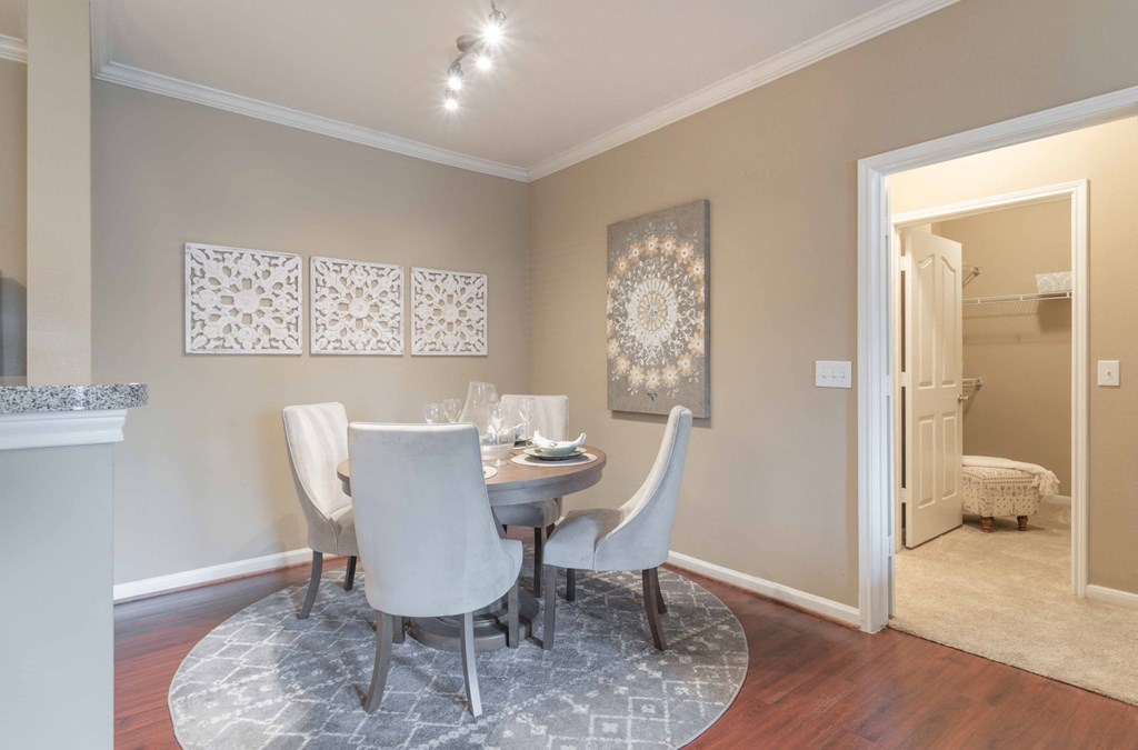 a dining room with a table and chairs a dining room with a table and chairs at Century South Shore, League City, TX