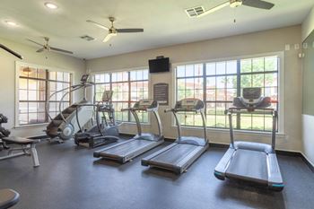 our apartments have a gym with a treadmill and elliptical machines at Century South Shore, League City, TX