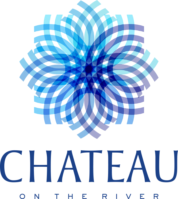 A graphic with a flower design and the words "Chateau on the River" written below it.