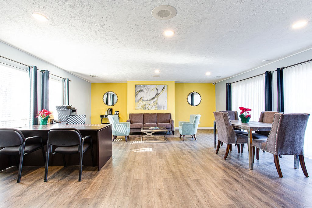Clubhouse with table and chairs  at Chelsea Place apartments Lithonia, GA