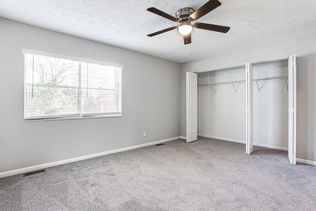 Bedroom with ceiling fan  at Chelsea Place apartments Lithonia, GA
