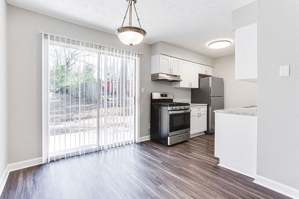 Dinning area and sliding glass door  at Chelsea Place apartments Lithonia, GA