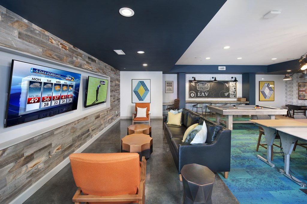 a recreation room with a shuffleboard table and couches at Marley EAV, Atlanta, GA, 30316