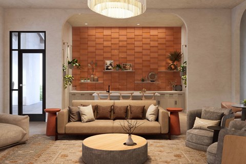 A living room with a brown couch and a round table in the middle.