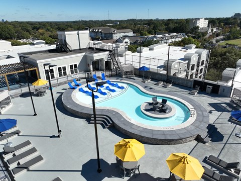 A pool with a hot tub in the middle of it.