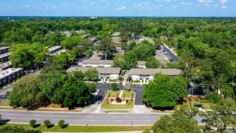 an aerial view of a city with a fountain in the middle of the road at Crescent Place Apartment, Savannah