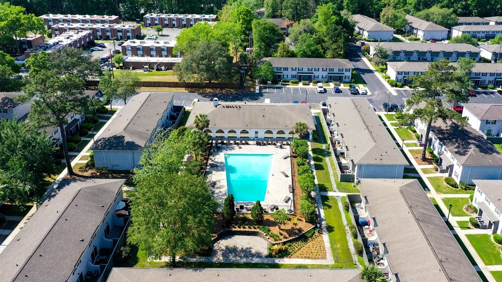 an aerial view of a community with a large swimming pool in the middle at Crescent Place Apartments, Savannah, 31419