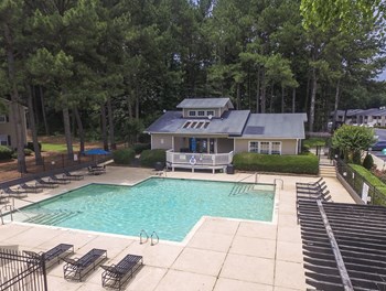 Swimming pool area at Harvard Place Apartment Homes by ICER, Lithonia, GA, 30058 - Photo Gallery 39