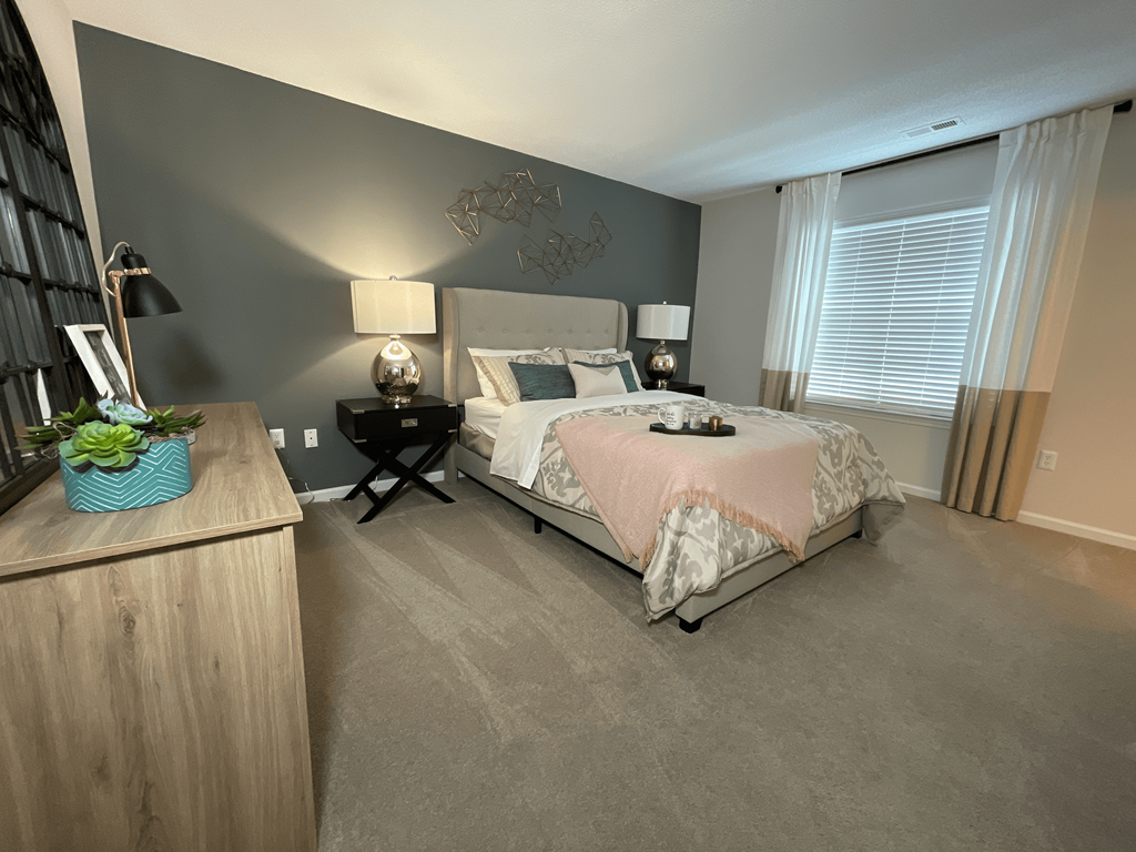 spacious bedroom featuring plush carpet and large windows at Palmetto Place, Fort Mill, 29708