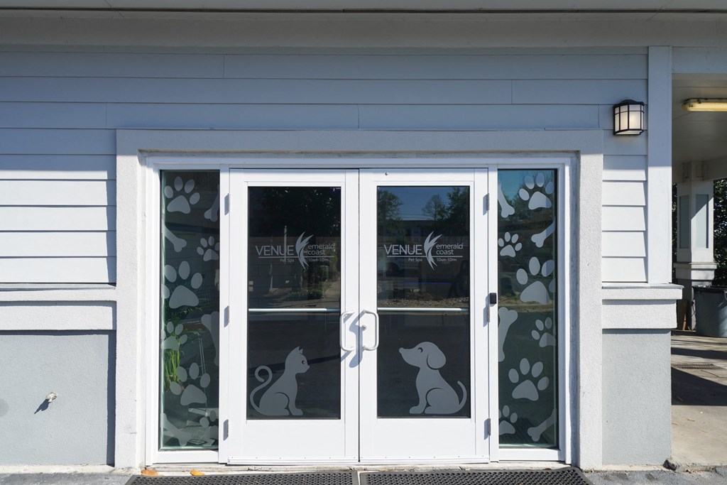 the doors to the veterinary clinic are decorated with images of bunnies and flowers