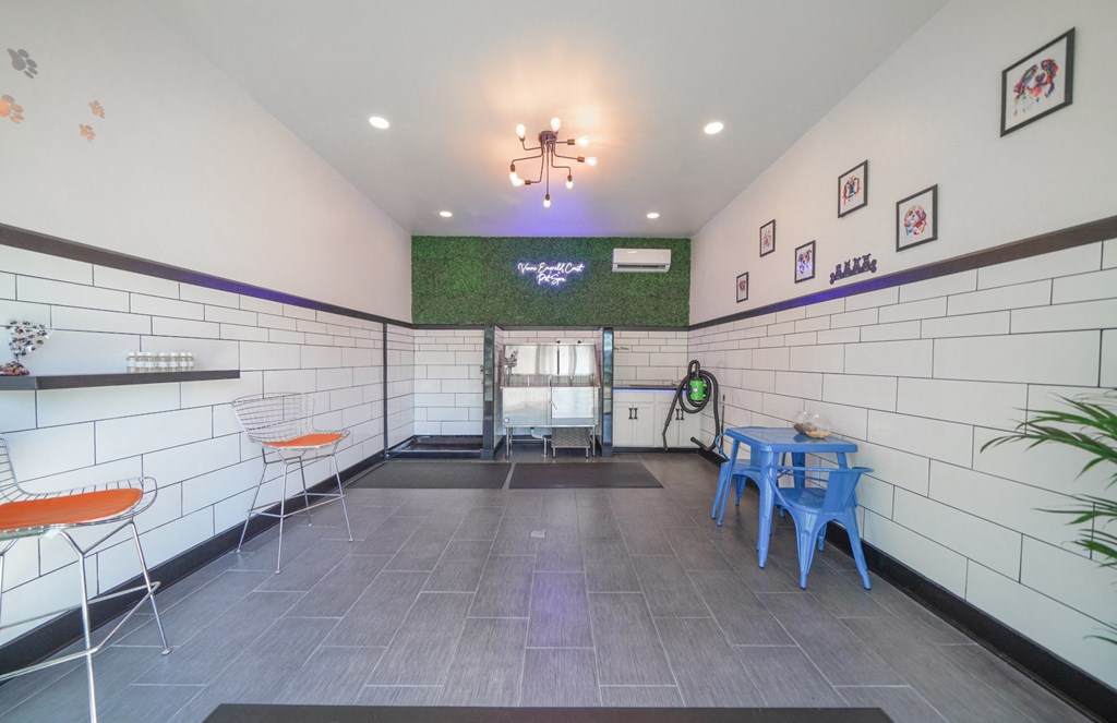 a dining room with a table and chairs and a chandelier hanging from the ceiling