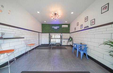 a dining room with a table and chairs and a chandelier hanging from the ceiling