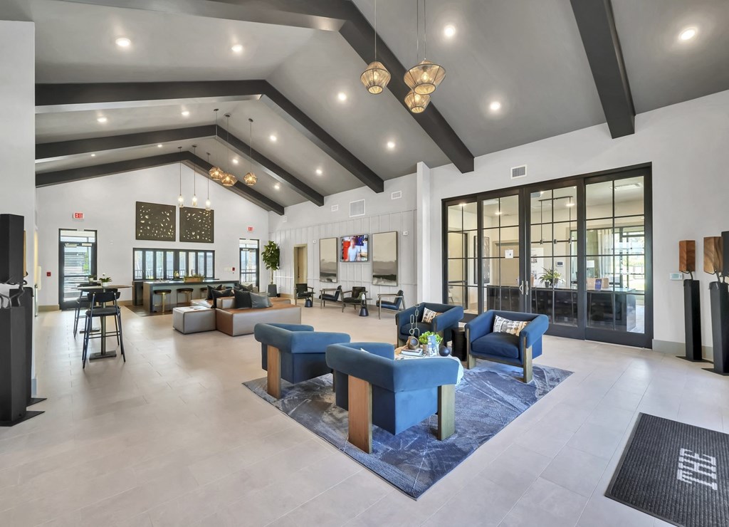 a large lobby with couches and chairs