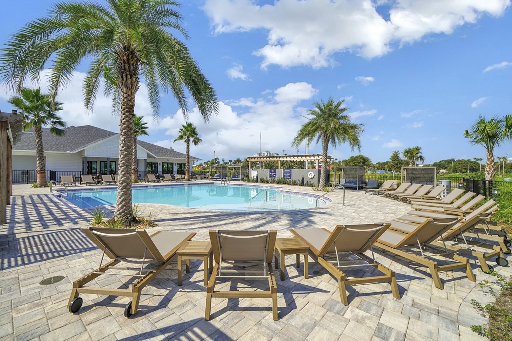 Pool with sundeck and patio at The Charles Apartments, Destin, FL, 32541