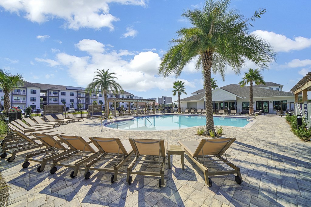 Pool with sundeck at The Charles Apartments, Florida, 32541