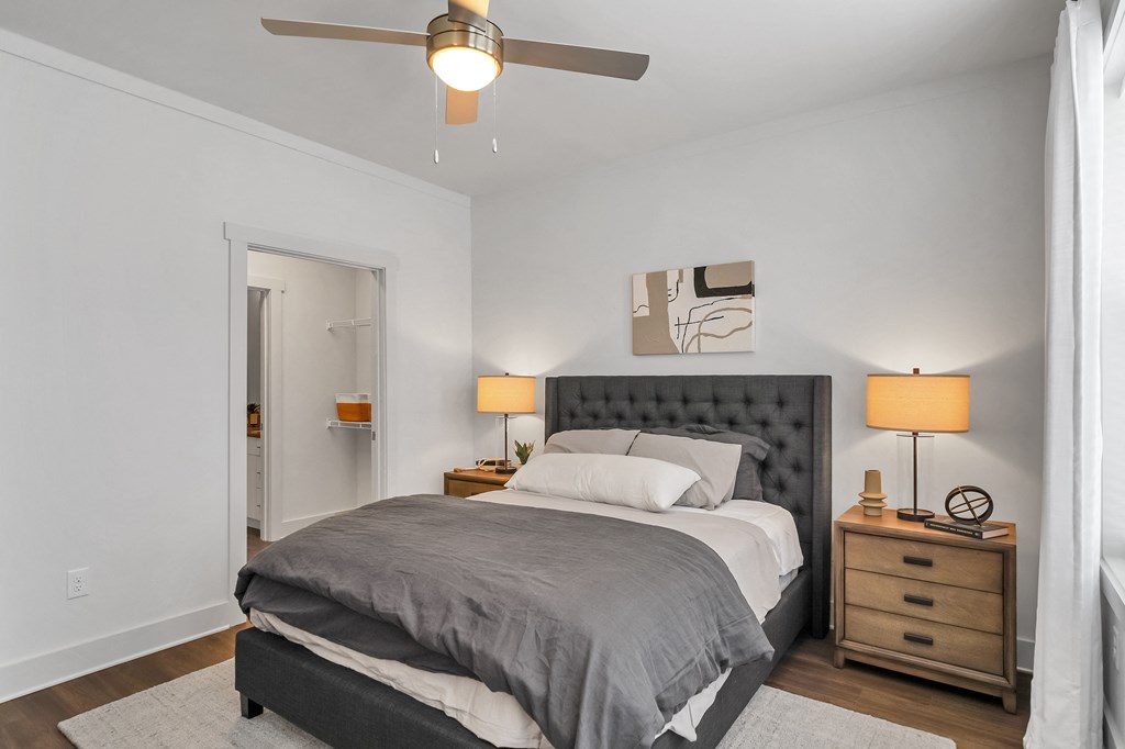 a bedroom with a bed and two night stands at The Indigo Apartments, Georgia, 30114
