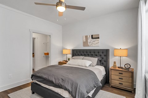 a bedroom with a bed and two night stands at The Indigo Apartments, Georgia, 30114