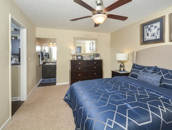 Bedroom with cozy bed1at Harvard Place Apartment Homes by ICER, Lithonia, GA - Photo Gallery 61