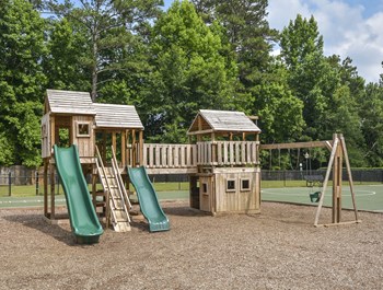 Play area at Harvard Place Apartment Homes by ICER, Lithonia, Georgia - Photo Gallery 77