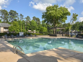 Pool side patio at Harvard Place Apartment Homes by ICER, Lithonia, 30058 - Photo Gallery 83