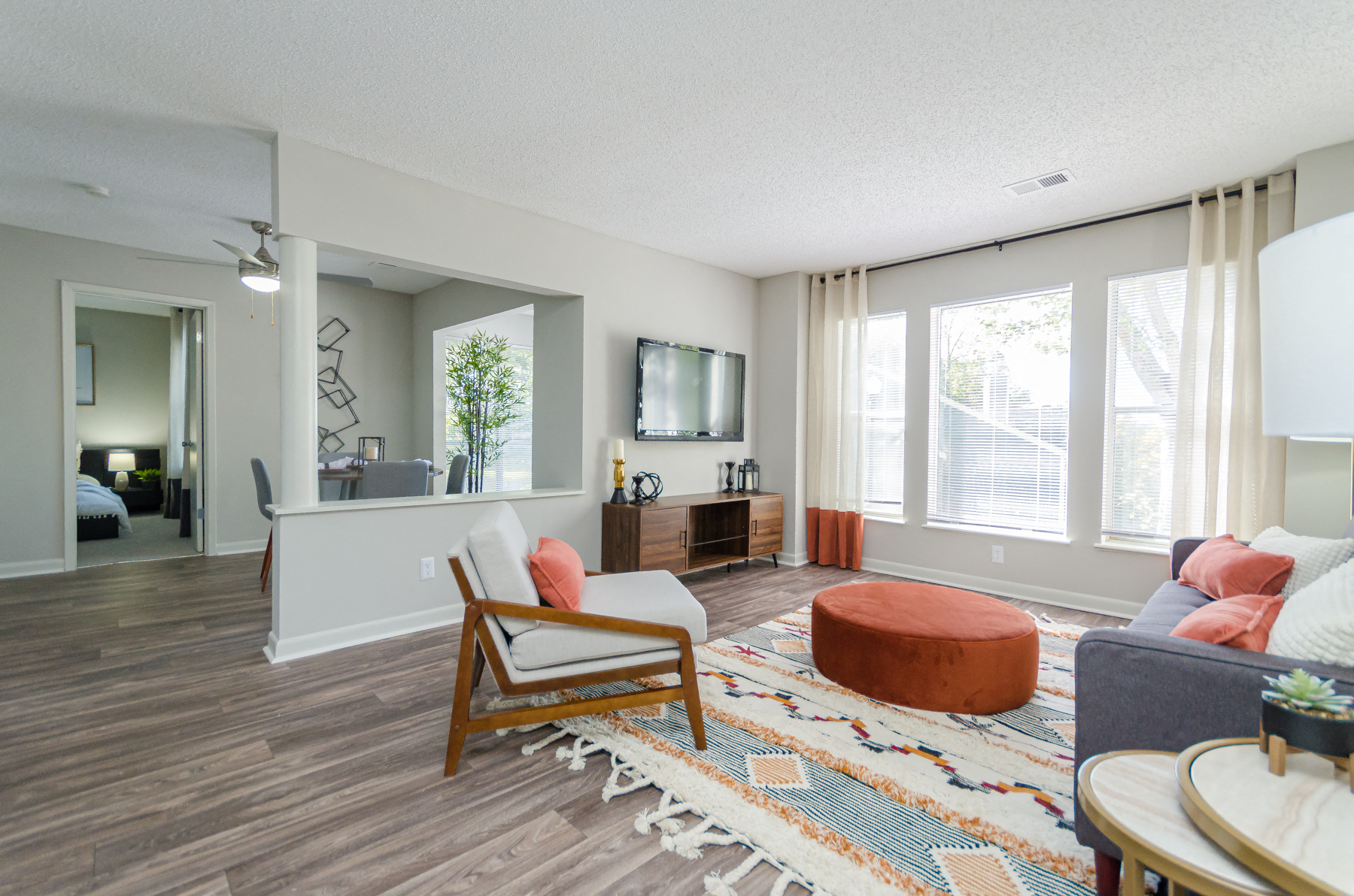 Living Area With Kitchen at The Carter 4250 Apartments, Norcross, Georgia