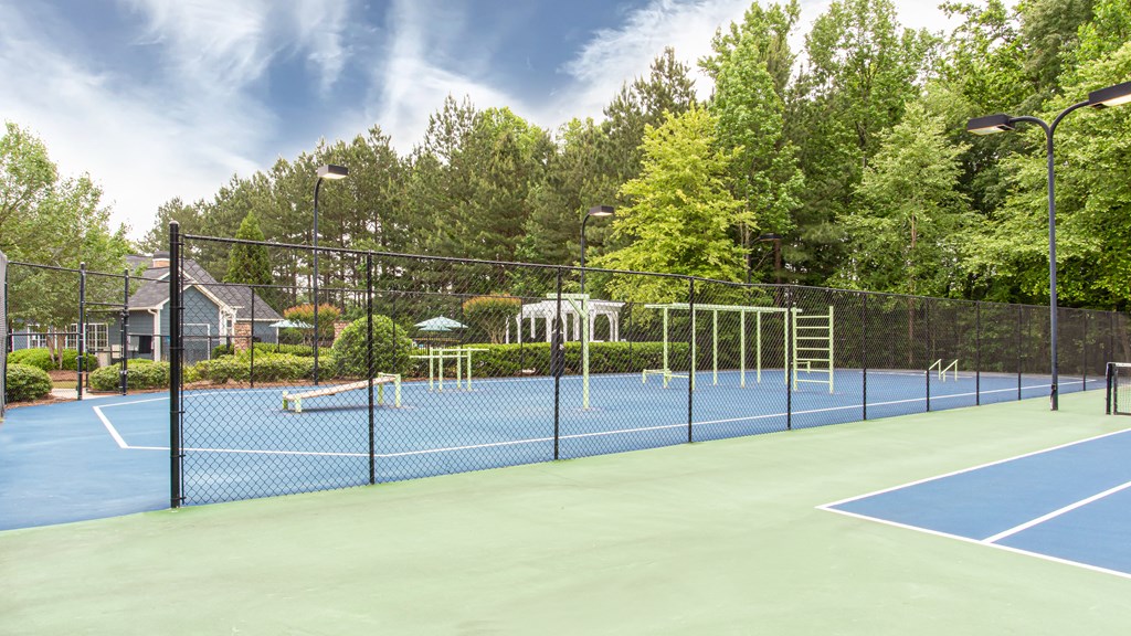 Brodick Hills tennis court with pool