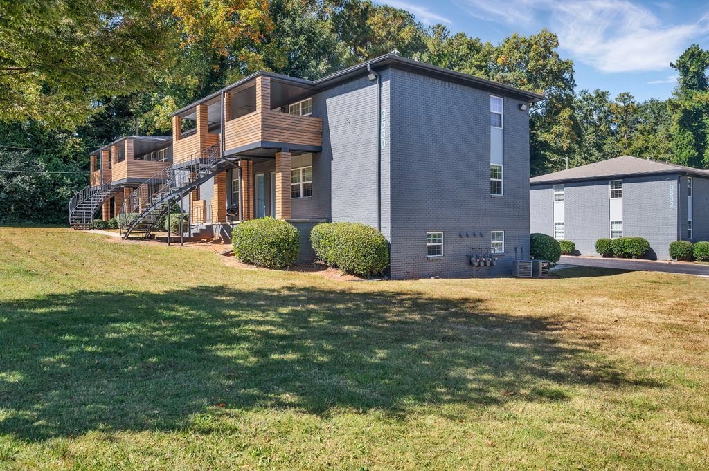 a house with a large yard in front of it