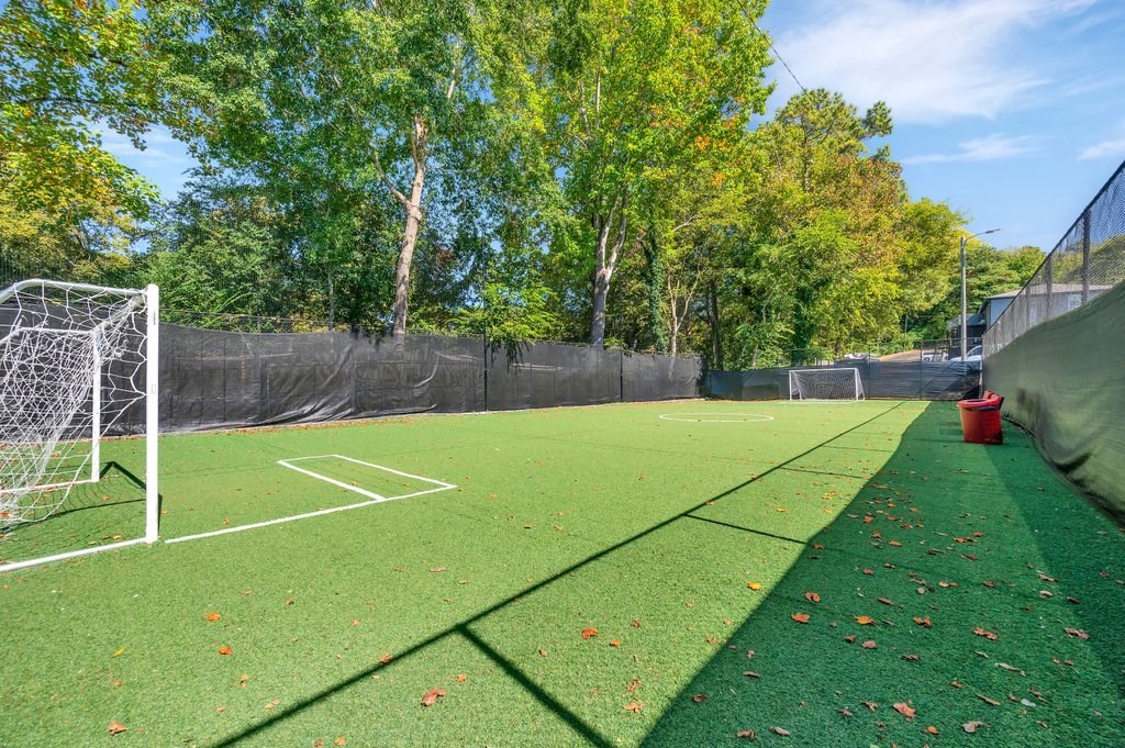 a soccer field with a goal and a net
