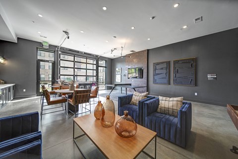 a living room with couches and chairs and a table