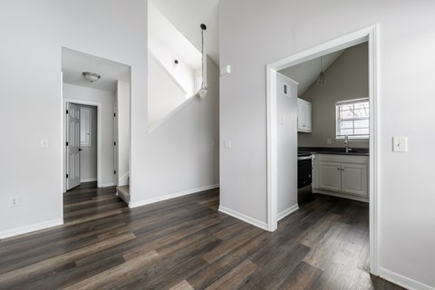 A kitchen area with a sink and a window.