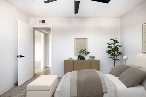 A bedroom with a bed, nightstand, and a plant.
