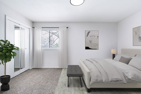A bedroom with a bed, a bench, and a plant.