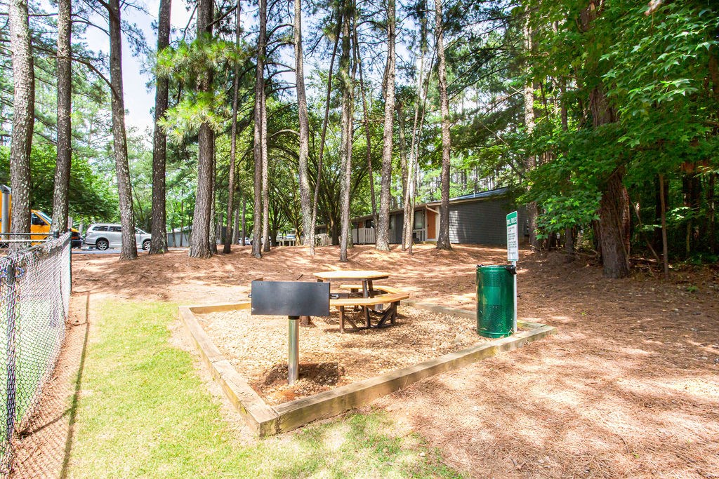 our apartments have a dog park with a grill and picnic table