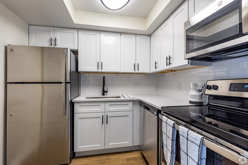 Spacious kitchen featuring stainless steel appliances at the Essex apartment homes located at The Essex, Altamonte Springs, Florida