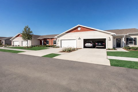 A house with a garage in front of it.