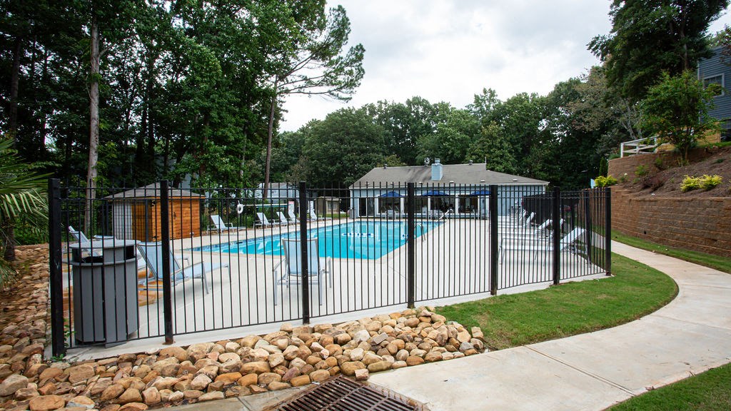 Outdoor Swimming Pool with walking path at The Cobb Apartments-Townhomes, Georgia