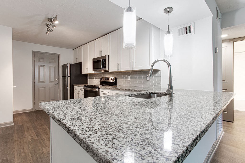 a kitchen with a granite counter top