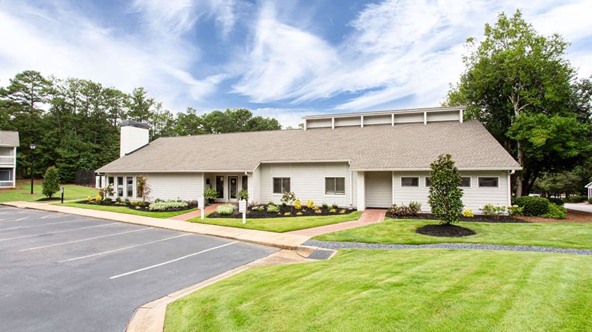 a white house with a driveway and a lawn - Photo Gallery