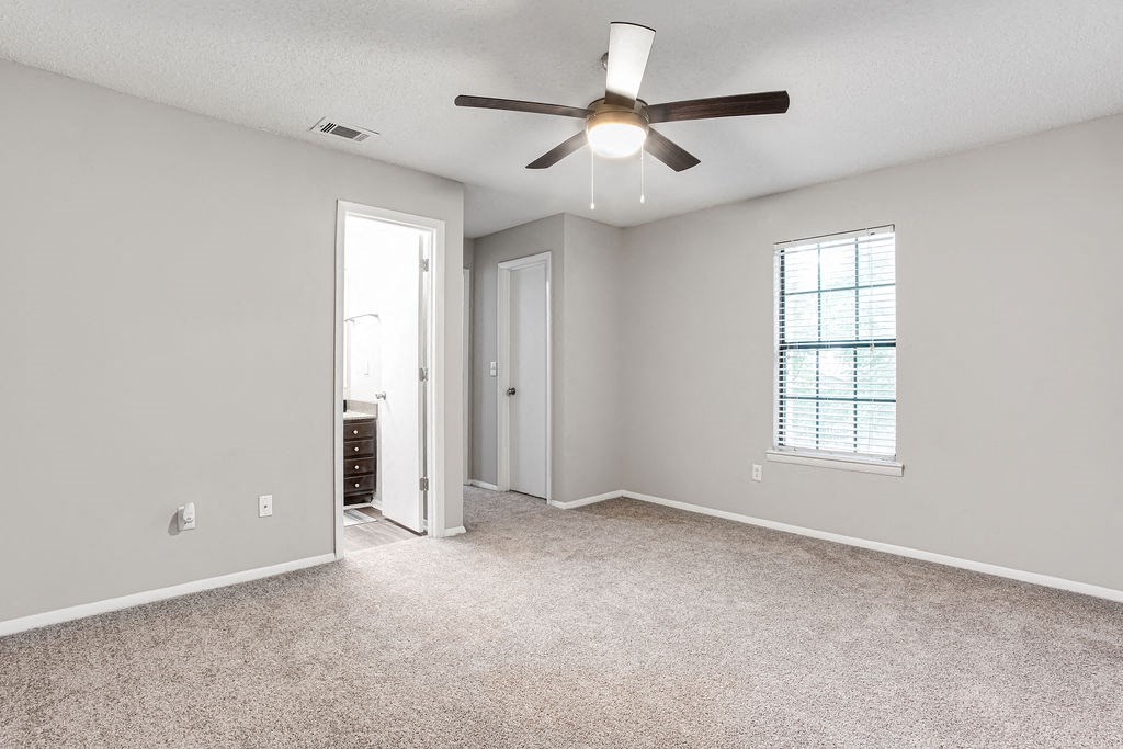living room with a ceiling fan at Magnolia Place at Stockbridge Apartments, Stockbridge, GA, 30281