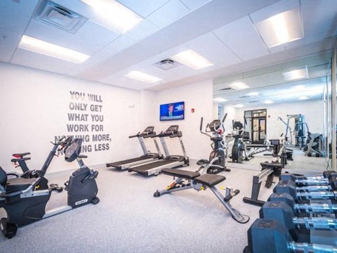 a gym with a lot of exercise equipment in it
