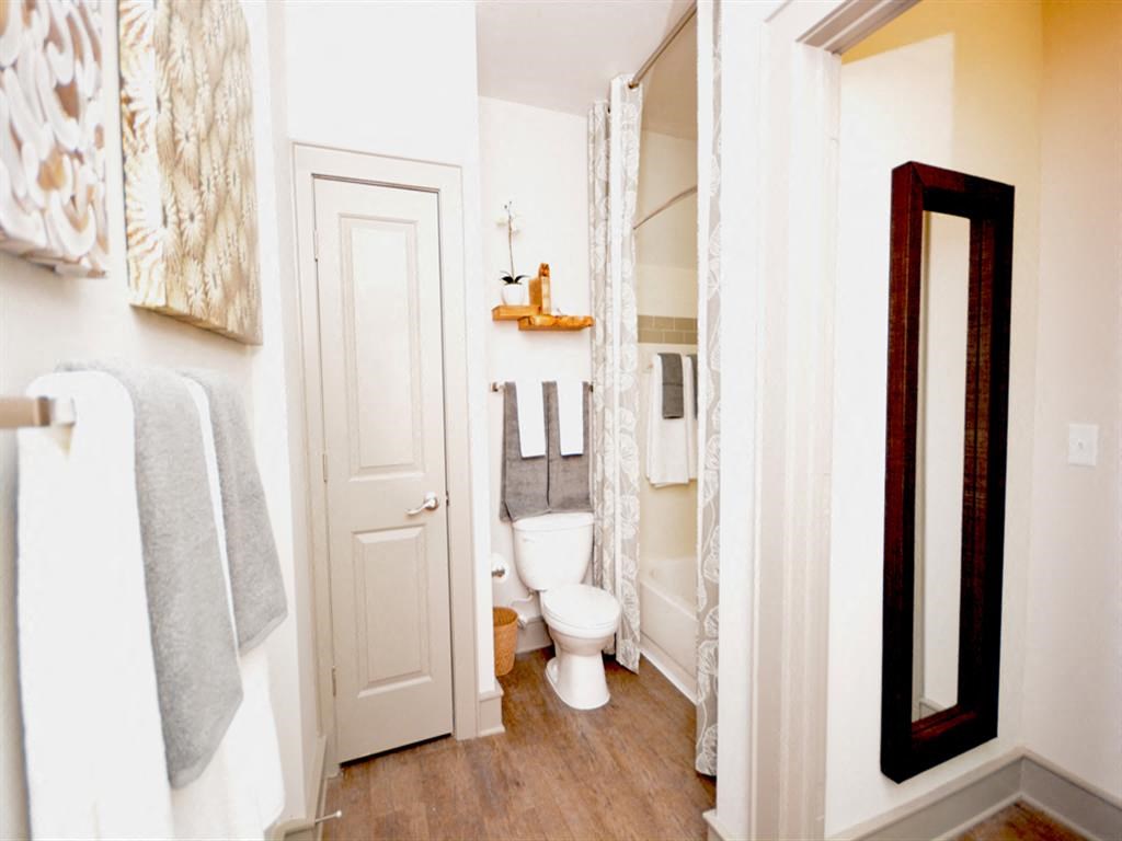 a small bathroom with a toilet and a mirror