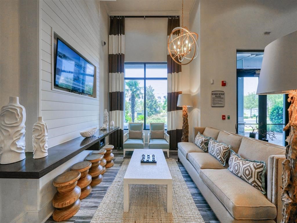 a living room with a couch and a coffee table and a television